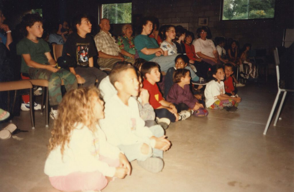 Children watch a performance inside the Lasowsky Centre