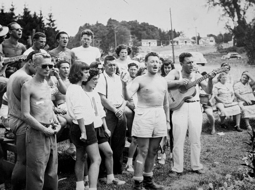 Naivelters gather for an outdoor sing-along