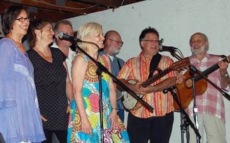 Community musicians perform at a Camp Naivelt concert