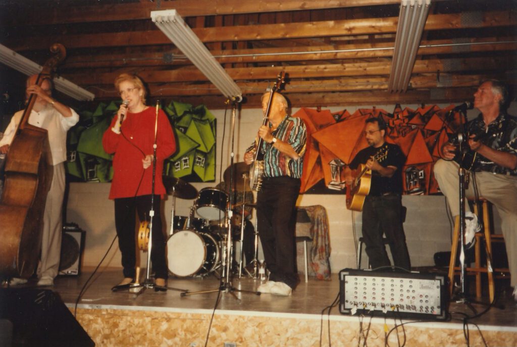 A folk band performs on the Camp Naivelt stage