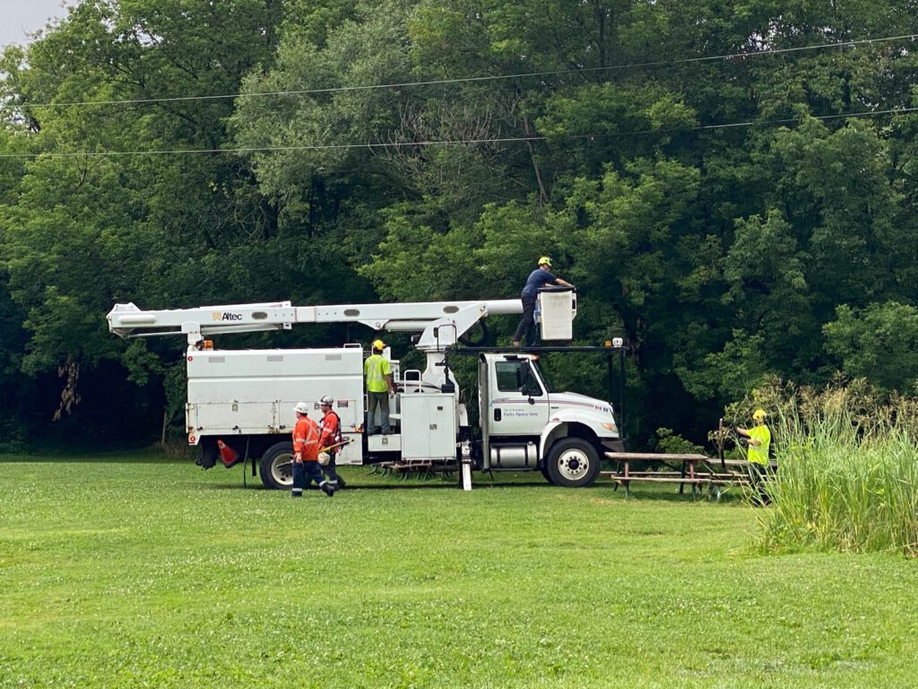 A hydro crew works on the power lines at Camp during the “Great Hydro Crisis”