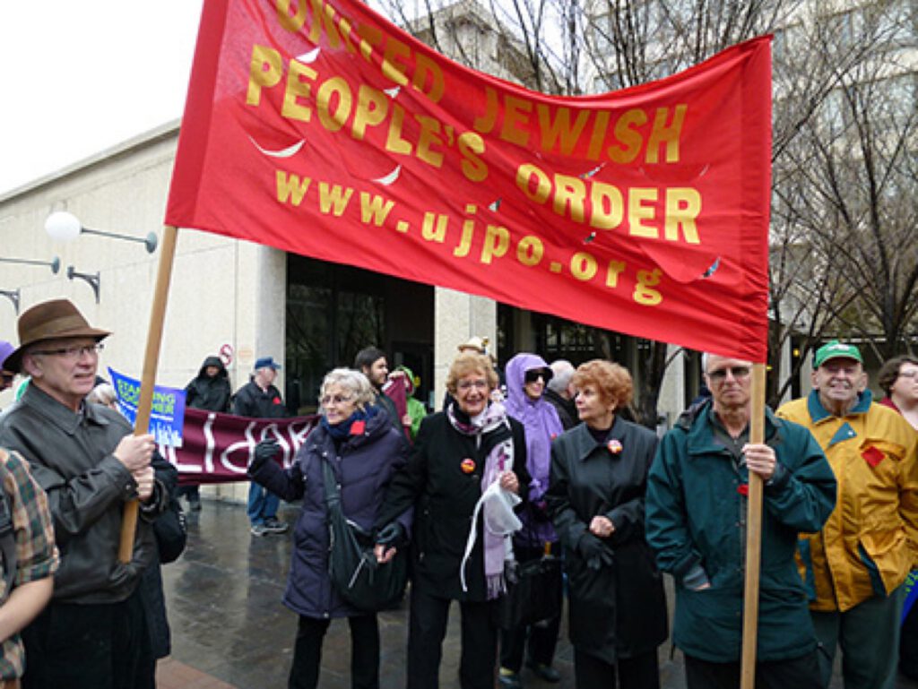Members of UJPO Winnipeg, including the late, beloved grande dame of the organization, Roz Usiskin (centre), march at a May Day rally