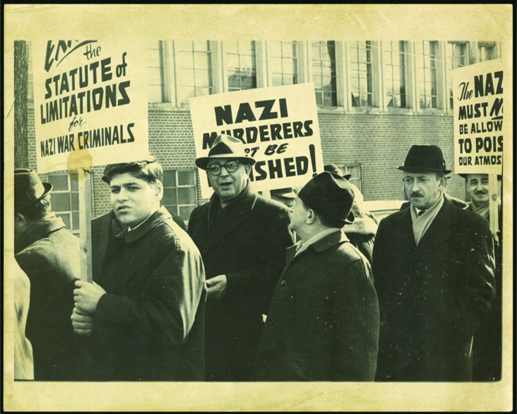 Members (including Vochenblatt editor Joshua Gershman, centre) protest the post-war admittance of Nazi war criminals into Canada
